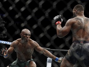 Tyron Woodley and Kamaru Usman, of Nigeria, fight during their welterweight title bout during UFC 235 at T-Mobile Arena on March 02, 2019 in Las Vegas, Nevada.