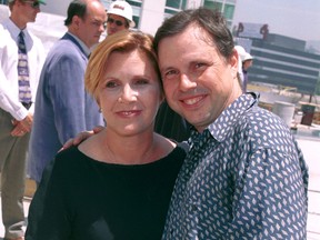 Actress Carrie Fisher and her brother Todd Fisher, the children of actress Debbie Reynolds, pose at the unveiling of the site of the new Hollywood Motion Picture Museum June 19, 2001 in Hollywood. (Getty Images)