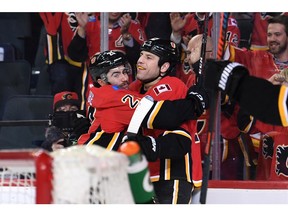 Dec 5, 2019; Calgary, Alberta, CAN; Calgary Flames left wing Milan Lucic (17) celebrates with center Dillon Dube (29) after scoring a third period goal against the Buffalo Sabres at Scotiabank Saddledome. The Flames won 4-3. Mandatory Credit: Candice Ward-USA TODAY Sports ORG XMIT: USATSI-405439