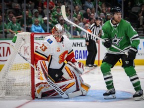 Oct 10, 2019; Dallas, TX, USA; Calgary Flames goaltender David Rittich (33) defends against Dallas Stars center Joe Pavelski (16) during the second period at the American Airlines Center. Mandatory Credit: Jerome Miron-USA TODAY Sports ORG XMIT: USATSI-405048