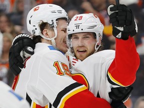 Dec 27, 2019; Edmonton, Alberta, CAN; Calgary Flames forward Elias Lindholm (28) celebrates a second period goal against the Edmonton Oilers at Rogers Place. Mandatory Credit: Perry Nelson-USA TODAY Sports ORG XMIT: USATSI-405583