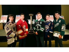 Calgary AAA players (L-R)  Heath Armstrong (Buffaloes), Kayden Smith (Flames), Sam Simard (Okotoks Oilers), Rhys Betham (Royals) and Clarke Huxley (Northstars) pose with the trophy at a press conference to kick off the Macs International Hockey Tournament in Calgary on Wednesday, December 11, 2019. Jim Wells/Postmedia