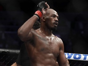 Jon Jones celebrates after defeating Anthony Smith following their light heavyweight title bout during UFC 235 at T-Mobile Arena in Las Vegas on March 2, 2019.