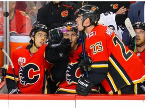 Calgary Flames Johnny Gaudreau celebrates with the purple gatorade with teammates Sean Monahan and Matthew Tkachuk after his goal against the Buffalo Sabres during NHL hockey in Calgary on Thursday December 5, 2019. Al Charest / Postmedia