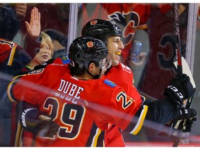Calgary Flames Milan Lucic celebrates with teammates after scoring a goal against the Buffalo Sabres during NHL hockey in Calgary on Thursday December 5, 2019. Al Charest / Postmedia