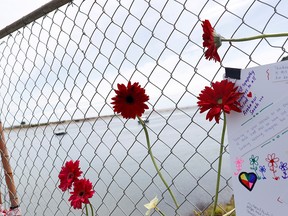 Flowers are seen at a memorial at the harbour in Whakatane, following the White Island volcano eruption in New Zealand, Dec. 11, 2019.