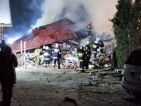 First responders work by the building at was levelled by a gas explosion in the ski resort town of Szczyrk, Poland December 4, 2019 in this image obtained from social media.