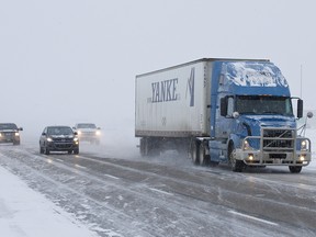 Trucks and cars drive south along Highway 2 outside of Leduc, Alta., on Saturday, Nov. 16, 2013. A snowstorm hit Alberta, with more than forty crashes in Edmonton alone. Ian Kucerak/Edmonton Sun/QMI Agency