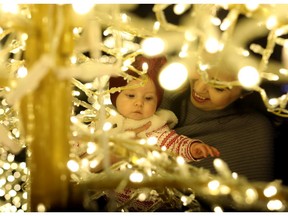 Mom Kirstin Shandrowski and daughter Aspen check out The Noël Christmas Light Park and Market at Stampede Park. Photo by Darren Makowichuk/Postmedia.