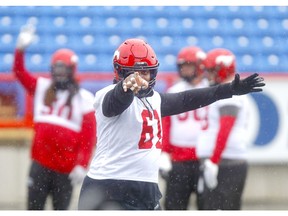 Right back at ya, big man! Calgary Stampeders OL Ucambre Williams has re-signed with the Red & White. File photo by Darren Makowichuk/Postmedia.