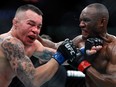 Colby Covington (L) takes a punch from UFC welterweight champion Kamaru Usman in their welterweight title fight during UFC 245 at T-Mobile Arena on Dec. 14, 2019, in Las Vegas.