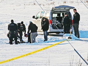 Police investigate at the scene of a suspicious death beside a bike path at the entrance to Fish Creek Provincial Park in Calgary on Sunday January 5, 2020. Gavin Young/Postmedia