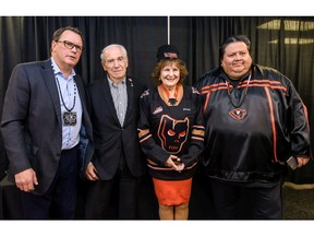Mike Moore, Vice President of Calgary Hitmen, left, Doug and Lois E. Mitchell, and Tyler White, CEO of Siksika Health Services, pose for a photo during a press conference regarding the February 1st ÔEvery Child MattersÕ game presented by Siksika Health Services in partnership with Siksika Child & Family Services and First Nations Health Consortium on Monday, January 27, 2020. Azin Ghaffari/Postmedia
