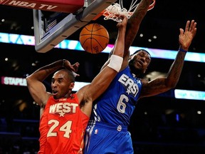 Kobe Bryant of the Los Angeles Lakers and the Western Conference dunks in front of LeBron James of the Miami Heat and the Eastern Conference in the second half of the 2011 NBA All-Star Game at Staples Center on February 20, 2011 in Los Angeles, California.