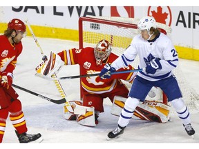 Calgary Flames goalie David Rittich battles Toronto Maple, Kasperi Kapanen in first period action at the Scotiabank Saddledome in Calgary on Thursday, December 12, 2019. Darren Makowichuk/Postmedia