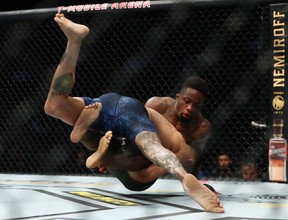 Sodiq Yusuff brings down Andre Fili during UFC 246 at T-Mobile Arena in Las Vegas on Saturday, Jan. 18, 2020.