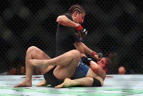 Roxanne Modafferi lands a hit against Maycee Barber on the mat during UFC 246 at T-Mobile Arena in Las Vegas on Saturday, Jan. 18, 2020.