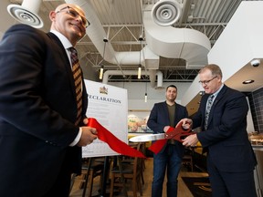 Rob Plante, left, with the Canadian Federation of Independent Business and Pasta Pantry owner Nathan Satanove, centre, were on hand as associate minister of red tape reduction, Grant Hunter declared Jan. 20-24 Red Tape Reduction Awareness Week in Alberta at Pasta Pantry in Edmonton, on Monday, Jan. 20, 2020.