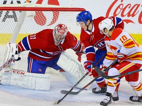 Montreal Canadiens goalie Carey Price with a save on Derek Ryan of the Calgary Flames during NHL hockey in Calgary on Thursday December 19, 2019. Al Charest / Postmedia
