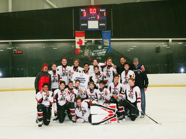 Calgary Herald, Jan. 19, 2020 The Bantam 4 champions at Esso Minor Hockey Week in Calgary on Jan. 18, 2020, were the Trails West 4 White Wolves. coryhardingphotography.com
