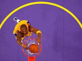 Los Angeles Lakers Kobe Bryant slam dunks during a game in Los Angeles on Jan. 28, 2011.