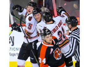 Calgary Hitmen Jonas Peterek celebrates with teammates after his goal against the Medicine Hat Tigers during WHL hockey in Calgary on Wednesday January 1, 2020. Al Charest / Postmedia