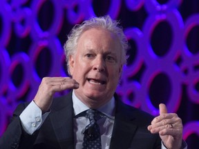 Jean Charest speaks during a panel discussion at the Canadian Aerospace Summit in Ottawa, Wednesday, Nov. 13, 2019.