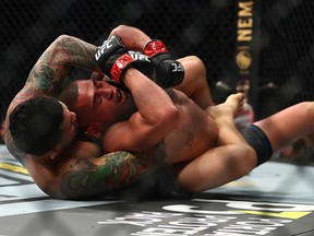 Diego Ferreira applies a hold against Anthony Pettis during UFC 246 at T-Mobile Arena in Las Vegas on Saturday, Jan. 18, 2020.