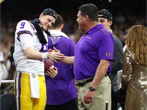 LSU Tigers head coach Ed Orgeron celebrates with quarterback Joe Burrow after defeating the Clemson Tigers in the College Football Playoff national championship game at Mercedes-Benz Superdome on Monday. Photo by Mark J. Rebilas/USA TODAY Sports.