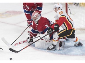 CP-Web.  Calgary Flames' Derek Ryan moves in on Montreal Canadiens goaltender Carey Price during third period NHL hockey action in Montreal on Monday, January 13, 2020.