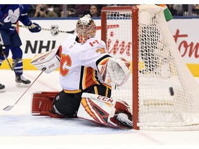 Jan 16, 2020; Toronto, Ontario, CAN;   Calgary Flames goalie David Rittich (33) makes a save against Toronto Maple Leafs in the second period at Scotiabank Arena. Mandatory Credit: Dan Hamilton-USA TODAY Sports ORG XMIT: USATSI-405721