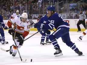 Calgary Flames Johnny Gaudreau skates around Toronto Maple Leafs Jake Gardiner during a game in Toronto on Oct. 30, 2018.