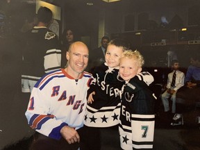Mark Messier with Matthew and Brady Tkachuk at the 2004 All-Star game in Saint Paul, Minn.