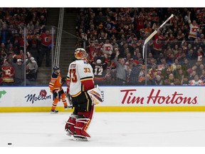 The Calgary Flames' goalie David Rittich (33) flips his goal stick in celebration after stopping the Edmonton Oilers' Leon Draisaitl (29) during the shootout at Rogers Place, in Edmonton Wednesday Jan. 29, 2020. Photo by David Bloom