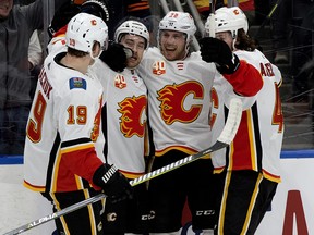 Calgary Flames celebrate Andrew Mangiapane's second-period goal against the Edmonton Oilers at Rogers Place on Wednesday, Jan. 29, 2020.