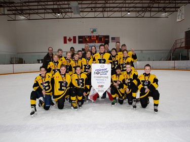 Calgary Herald, Jan. 19, 2020 Pushing through for the Esso Minor Hockey Week Pee Wee 5 North title in Calgary on Jan. 18, 2020, were the Bow River 5 Bruins. coryhardingphotography.com