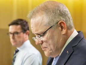 Australia Prime Minister Scott Morrison (right) and Minister for Water Resources, Drought, Rural Finance, Natural Disaster and Emergency Management, David Littleproud speak during a press conference on Jan. 2, 2020 in Sydney, Australia.
