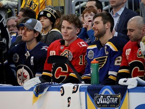 Matthew Tkachuk  of the Calgary Flames looks on from the bench during the 2020 NHL All-Star Skills Competition on Jan. 24, 2020, in St Louis.