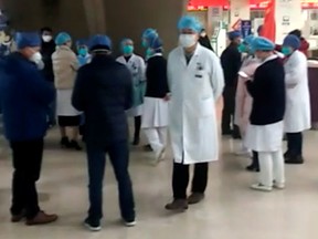 People are seen at Wuhan Union Hospital in Wuhan, China Jan. 22, 2020, in this screengrab obtained from a social media video.