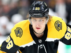 BOSTON, MASSACHUSETTS - JANUARY 03: David Pastrnak #88 of the Boston Bruins looks on during the third period of the game against the Calgary Flames at TD Garden on January 03, 2019 in Boston, Massachusetts. The Bruins defeat the Flames 6-4. (Photo by Maddie Meyer/Getty Images)