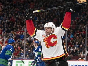 VANCOUVER, BC - FEBRUARY 08: Milan Lucic #17 of the Calgary Flames celebrates after scoring a goal against the Vancouver Canucks during NHL action at Rogers Arena on February 8, 2020 in Vancouver, Canada. (Photo by Rich Lam/Getty Images)