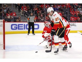 Sean Monahan of the Calgary Flames scores a first-period goal past Jonathan Bernier of the Detroit Red Wings at Little Caesars Arena on February 23, 2020 in Detroit, Michigan.