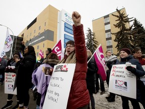 Members of the United Nurses of Alberta rally in support of publicly delivered healthcare and front-line workers, outside the Royal Alexandra Hospital in Edmonton Thursday Feb. 13, 2020. The protests were held at 33 locations in 25 communities across the province. Photo by David Bloom