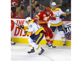 Calgary Flames, Matthew Tkachuk battles Nashville Predators, Craig Smith in first period action of at the Scotiabank Saddledome in Calgary on Thursday, February 6, 2020. Darren Makowichuk/Postmedia