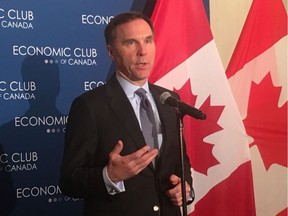 Federal Finance Minister Bill Morneau speaks to reporters in Calgary following a morning address to members of the Economic Club of Canada on Monday, Feb. 10, 2020.