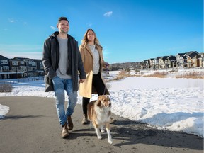 Christina Ryan, Calgary Herald, Calgary, Alberta: FEBRUARY 16, 2020 - Cameron LaRocque and Morgan Taylor walk their pooch Bindi in the park at Cranston's Riverstone, in Calgary on Sunday, February 16, 2020. Their new home being built by Trico Homes allows the to enjoy the wildlife and nature right outside their door.(Christina Ryan/Calgary Herald) (For Content Works section story by ) Trax#