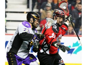 The Calgary Roughnecks Dane Dobbie and the San Diego Seals Eli Gobrecht jostle during National Lacrosse League action in Calgary on Saturday, February 29, 2020.  Gavin Young/Postmedia