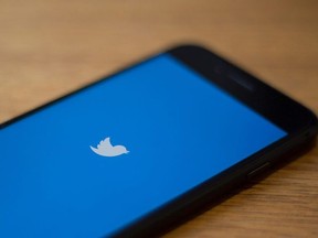 In this file photo taken on July 10, 2019 the Twitter logo is seen on a phone in in Washington, D.C.