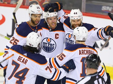 Edmonton Oilers Zack Kassian celebrates with teammates after scoring a goal against the Calgary Flames during NHL hockey in Calgary on Saturday February 1, 2020.