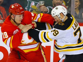 Calgary Flames Matthew Tkachuk fights Jeremy Lauzon of the Boston Bruins at the Saddledome on Friday, Feb. 21, 2020.